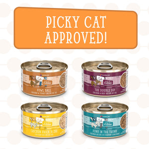 Four cans of cat food with illustrated cats on the labels are displayed beneath a sign that says “Picky Cat Approved!” This Weruva Lotta Good Lotta Yum variety pack features premium protein recipes, including Fowl Ball, The Double Dip, Chicken Frick A Zee, and Funk in the Trunk.