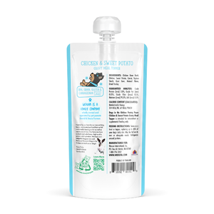 A white squeeze pouch with a spout, labeled Dogs in the Kitchen Chicken & Sweet Potato Gravy Meal Topper. The back lists ingredients, guaranteed analysis, feeding tips, and a company story—great as a dog gravy or topper with chicken bone broth.