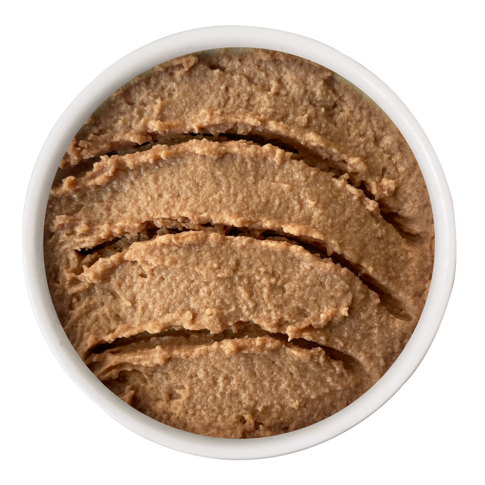 A circular container of Cat Person Chicken & Duck Juicy Paté, filled with smooth, textured chicken and duck cat food.
