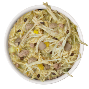 A bowl of soup with noodles, shredded cabbage, mushrooms, ground meat, and beans in light broth—just like Weruva's Amazon Livin' Recipe Plus dog food for easy digestion.