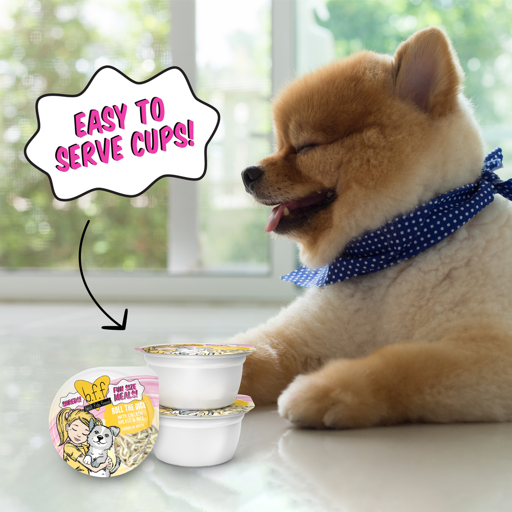 A fluffy brown Pomeranian in a blue polka dot bandana sits by two BFF Best Fido Friend Roll The Dice chicken & rice dog food cups. A speech bubble says “Easy to serve cups!” with an arrow pointing at the stacked containers cooked in broth.