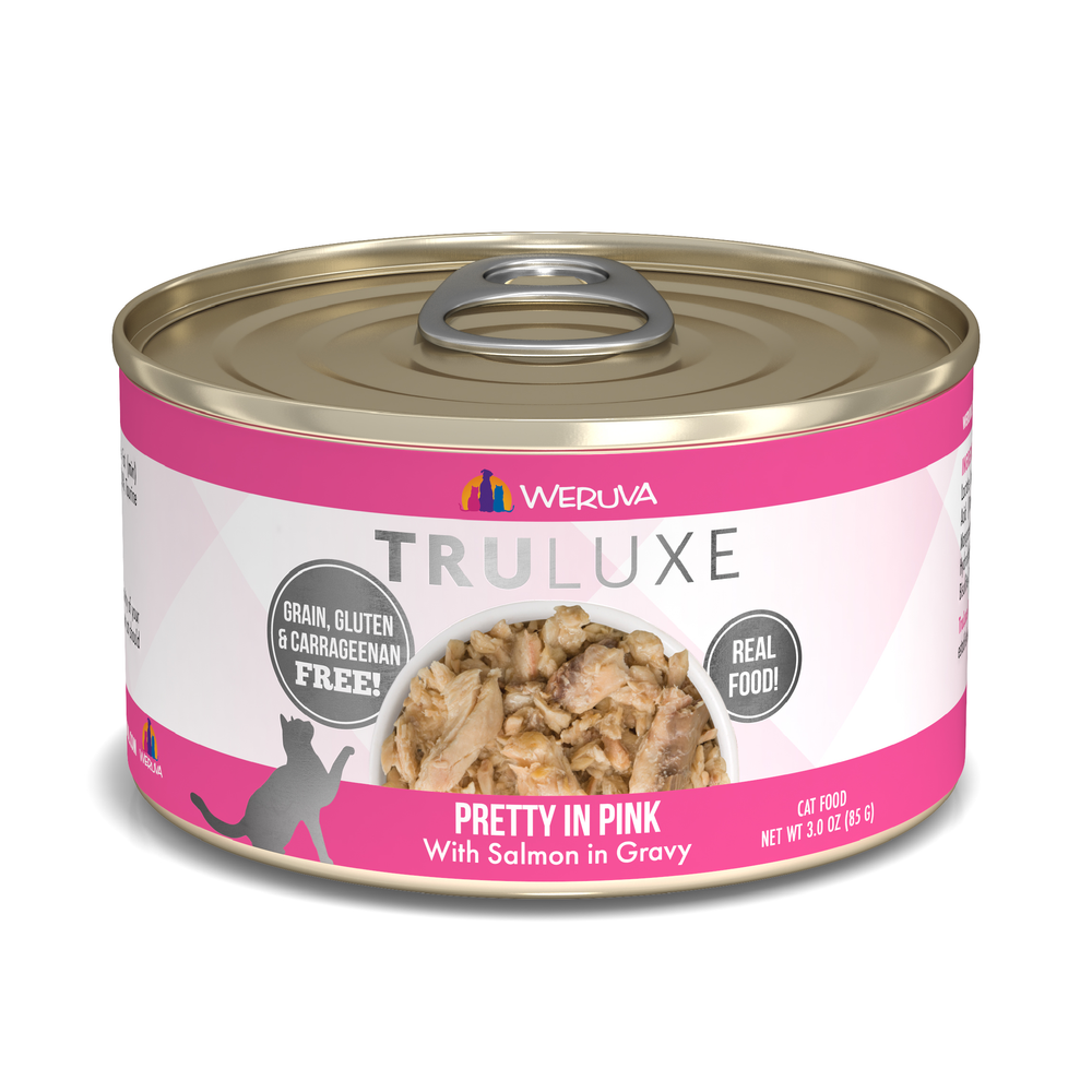 A can of TruLuxe Pretty in Pink cat food with wild-caught salmon in gravy, featuring a pink and white label, refined nutrition, grain-, gluten-, and carrageenan-free formula, real food ingredients, and a cat silhouette.