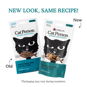 Two bags of Cat Person Salmon Savory Crunchies cat treats—Old on the left, New on the right—show similar designs. Text above says: NEW LOOK, SAME RECIPE! Low calorie treats to help keep your cat’s coat shiny and healthy.
