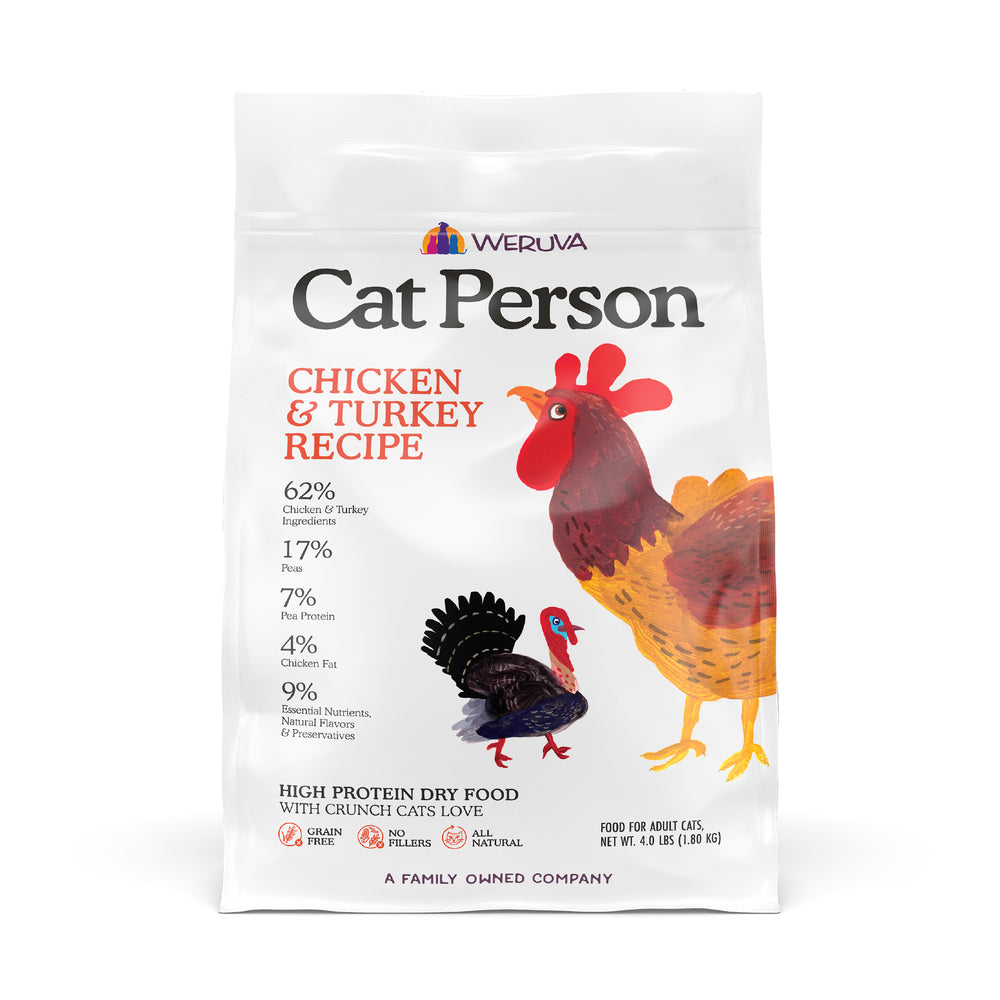 A white bag of Cat Person Chicken & Turkey Dry Food features colorful chicken and turkey illustrations. The label highlights the Chicken & Turkey Recipe and nutritional info, with the Cat Person brand name displayed at the top.
