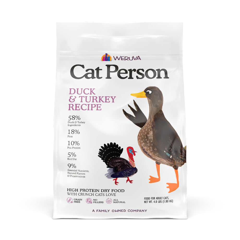 A white bag of Cat Person Duck & Turkey Dry Food, a high-protein cat food, featuring illustrated duck and turkey images. The packaging highlights protein content and key nutritional details.