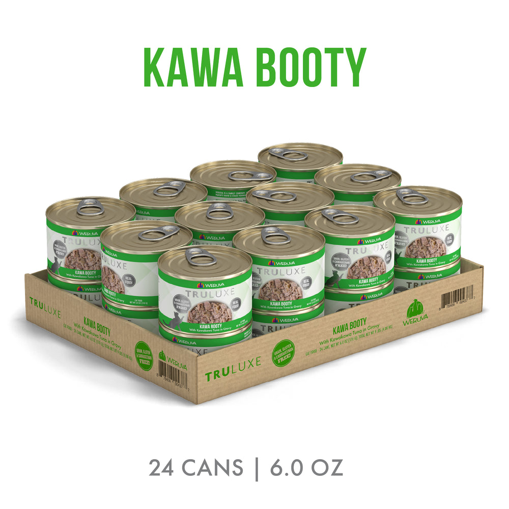 A cardboard tray holds 24 cans of TruLuxe Kawa Booty cat food with green and white labels. “KAWA BOOTY” appears above, “24 CANS | 6.0 OZ” beneath, highlighting wild-caught kawakawa tuna for refined nutrition.