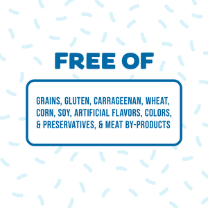 A sign with blue text reads: Weruva Lickable Chicken & Pumpkin Cat Treat—grain, gluten, carrageenan, wheat, corn, soy, artificial flavor, color & preservative free. Blue confetti shapes decorate the background.