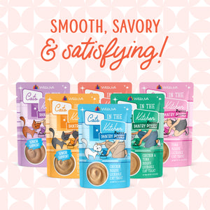 Five colorful pouches of Cats in the Kitchen Tuna Bisque cat food are displayed before a pink patterned background with bold text above reading, Smooth, savory & satisfying! Each pouch showcases playful cat illustrations.