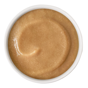 A white bowl filled with smooth Chicken & Tuna Bisque from Cats in the Kitchen, resembling a lickable treat, viewed from above on a white background.