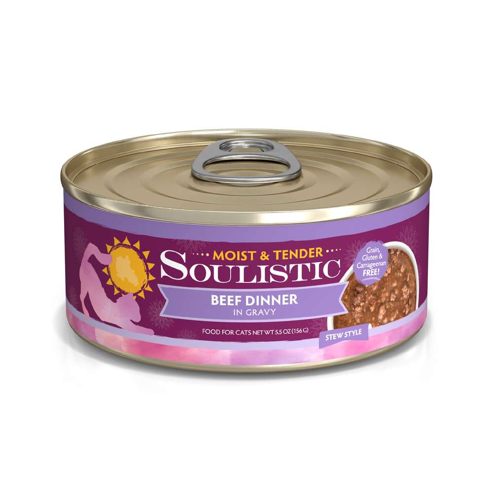 A can of Soulistic Beef Dinner in Gravy cat food, with deboned beef for quality protein. Labeled Moist & Tender Stew Style, it features a purple and gold design, sun logo, and a person petting a cat silhouette.