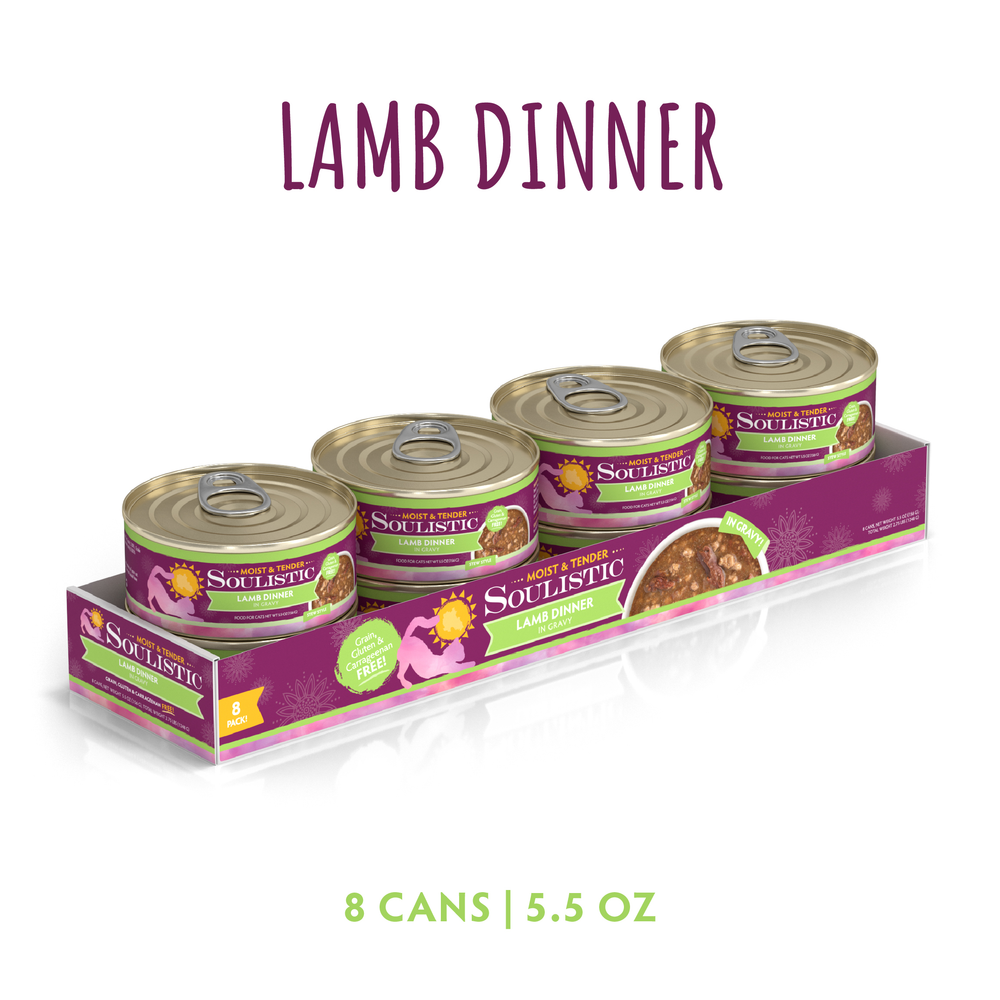 A package of eight 5.5 oz Soulistic Lamb Dinner in Gravy cat food cans, featuring deboned lamb for high-quality protein, in a purple tray labeled "Lamb Dinner in Gravy" with images of the cans and food.
