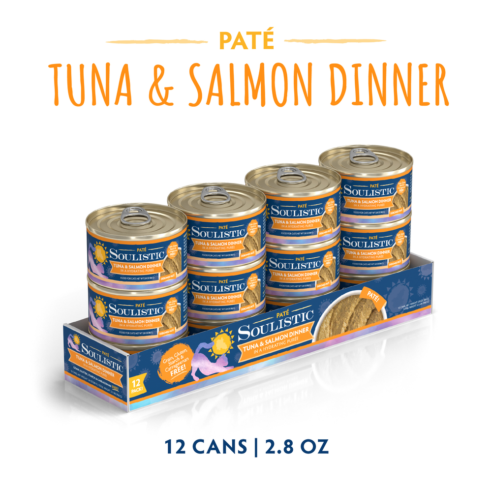 A 12-pack of Soulistic Tuna & Salmon Dinner in a Hydrating Purée, 2.8 oz cans, with wild-caught tuna; grain, gluten, and MSG free. Packed in a tray with orange and blue labels for wholesome nutrition.