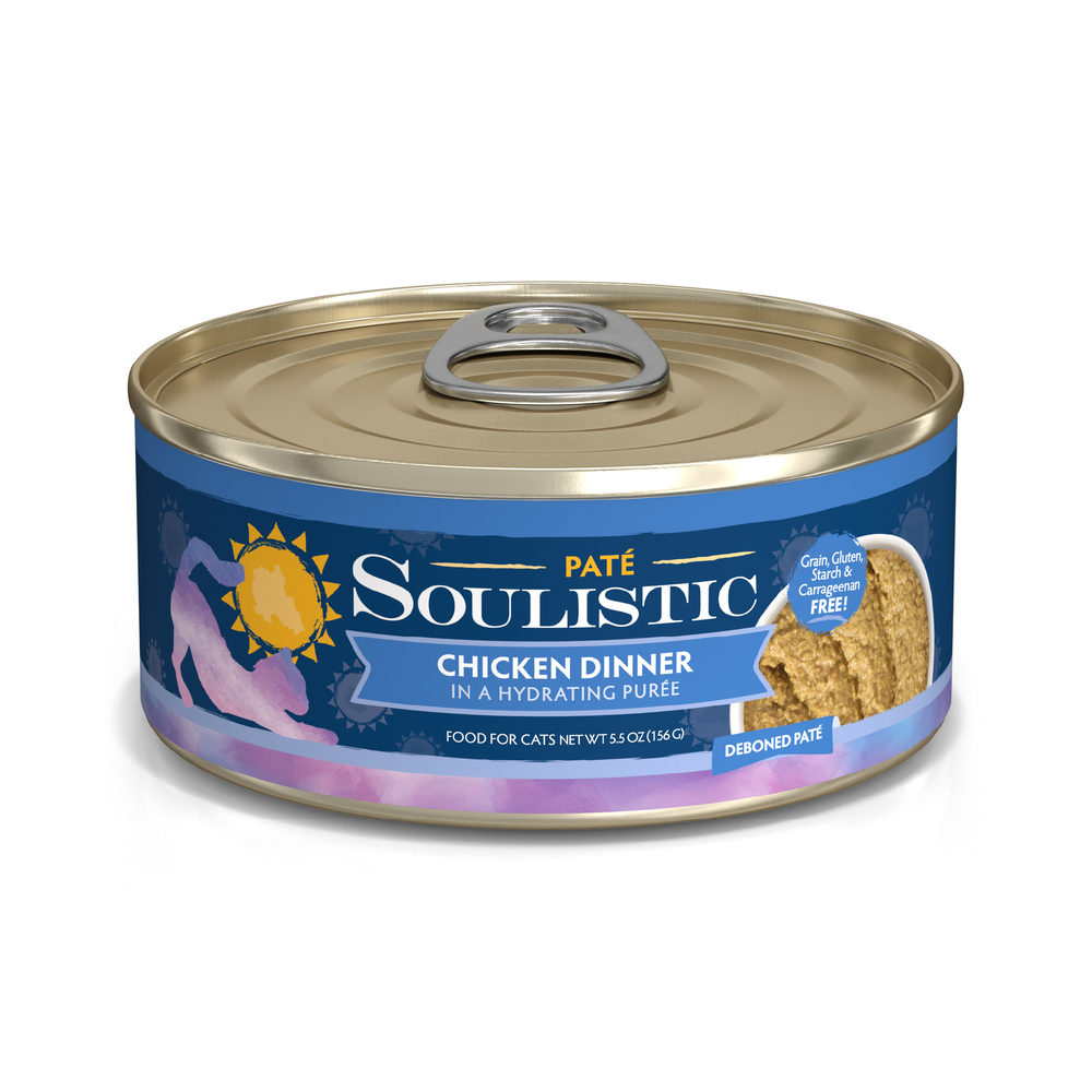 Soulistic Chicken Dinner in a Hydrating Purée cat food comes in a can with a blue and gold label, cat silhouette, and sun logo. It's grain, gluten, and carrageenan free for balanced nutrition.