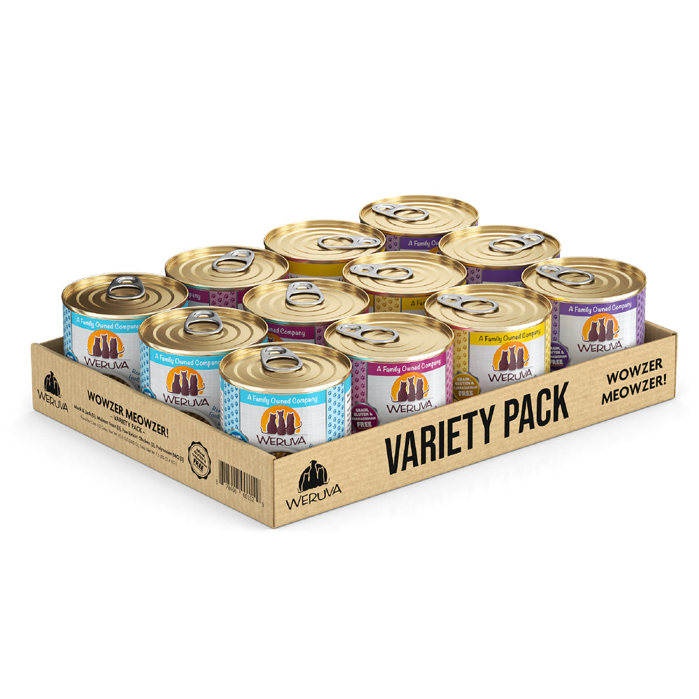 A cardboard tray labeled Wowzer Meowzer! by Weruva holds twelve cat food cans with hand-flaked fish and boneless chicken in blue, yellow, and purple labels, arranged neatly in three rows.