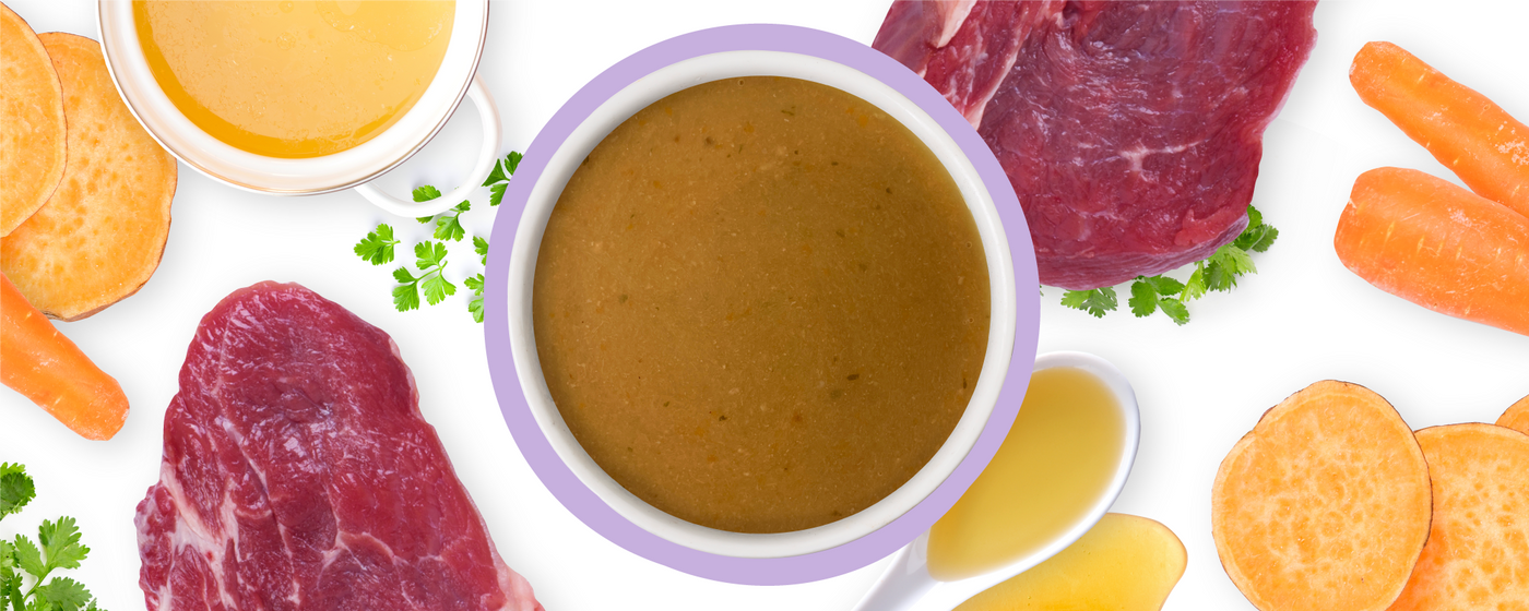 A bowl of brown soup in the center, surrounded by raw steak, sweet potato slices, carrots, parsley, a small cup of broth, and a spoonful of liquid, all on a white background.