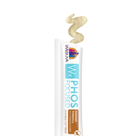 A white tube labeled Weruva Wx Lickable Chicken Cat Treat dispenses a beige, creamy treat for cats, specially formulated with low phosphorus.