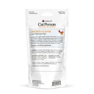Back of a white Cat Person bag labeled Chicken Savory Crunchies cat treats. The packaging lists ingredients, nutrition facts, feeding instructions, and company info. A small chicken icon appears near the flavor name for these crunchy treats.