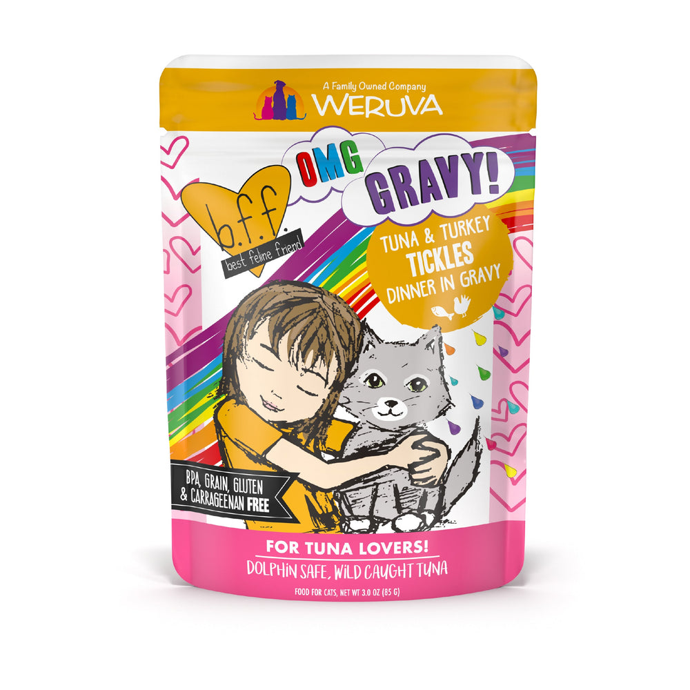 A colorful pouch of BFF Best Feline Friend Tuna & Turkey Tickles cat food with wild-caught tuna, gravy, a girl hugging a gray cat illustration, and text stating it's grain free and dolphin safe.