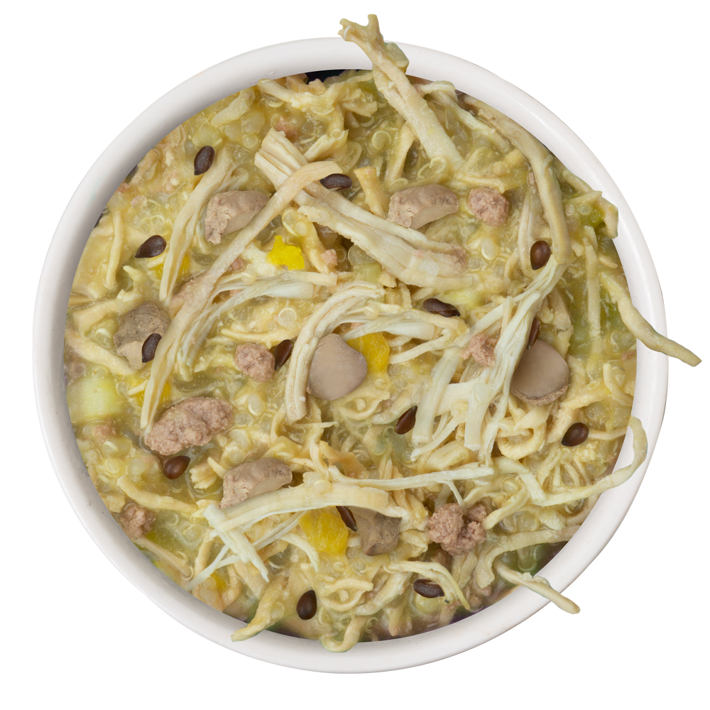A bowl of Amazon Livin' Recipe Plus by Weruva, featuring quinoa, shredded cabbage, mushrooms, ground meat, yellow bell peppers, and black beans in a light broth, viewed from above.
